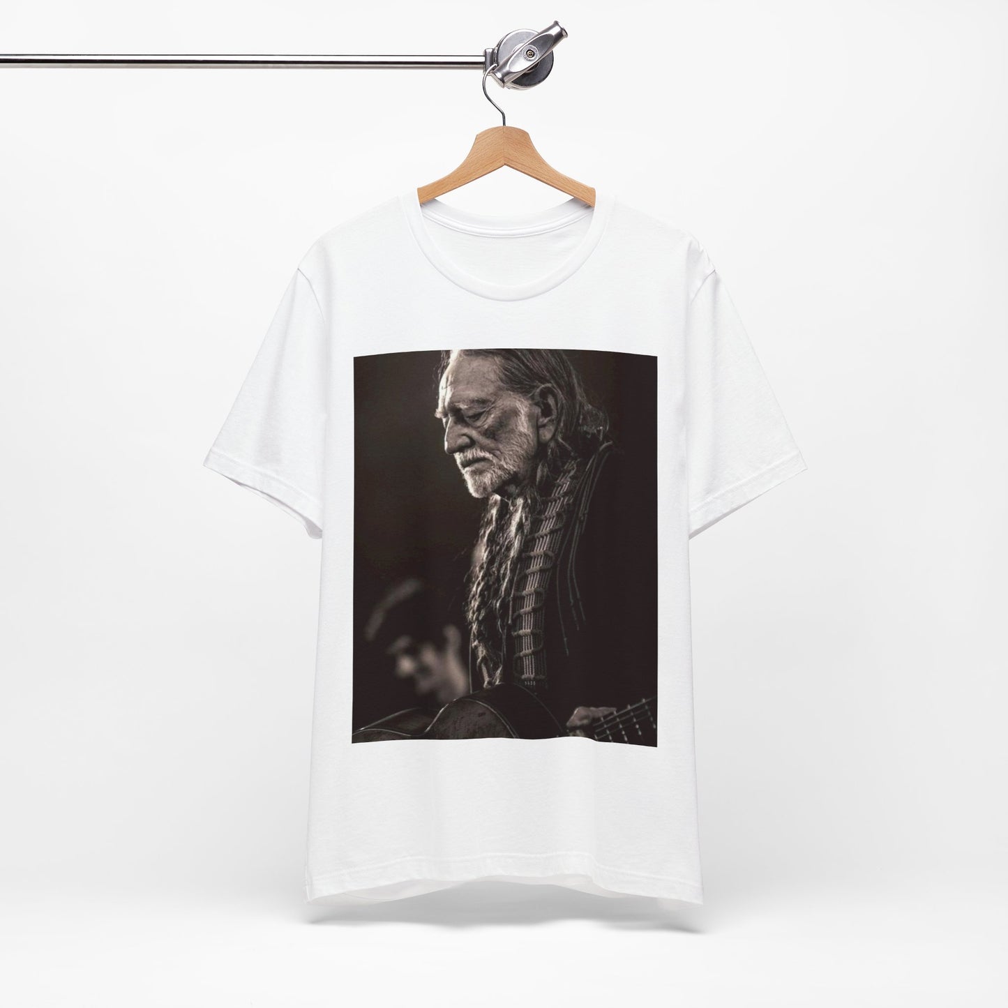 A black graphic t-shirt featuring a vintage country legend graphic of Willie Nelson.