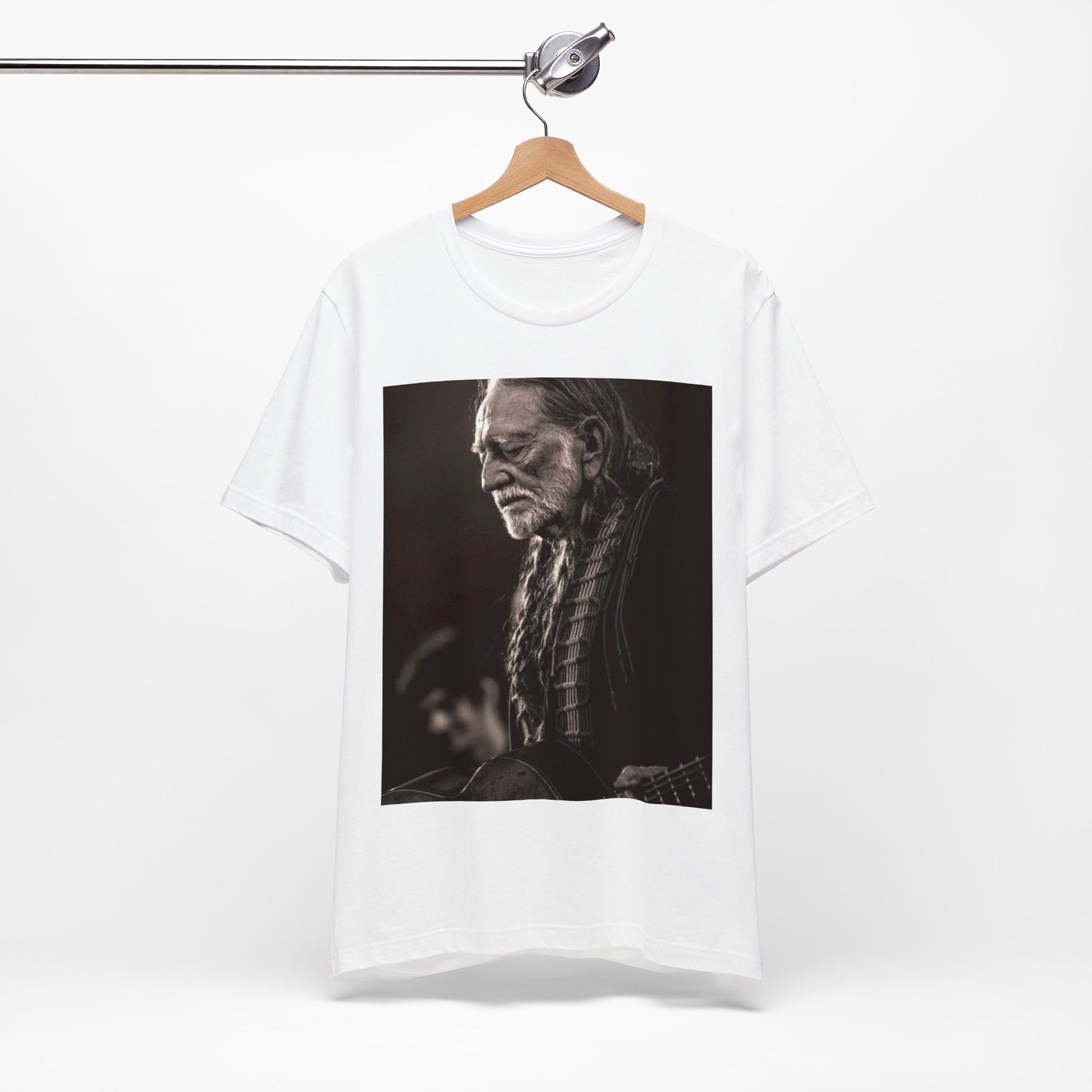 A black graphic t-shirt featuring a vintage country legend graphic of Willie Nelson.