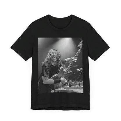 A black graphic t-shirt featuring a graphic of Dave Grohl from Foo Fighters playing guitar in concert.
