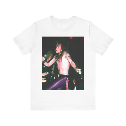 A black graphic t-shirt featuring a graphic of Axl Rose from Guns N' Roses performing on stage in the 80s.
