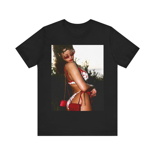 A black graphic t-shirt featuring a photo graphic of Rihanna in a bikini.