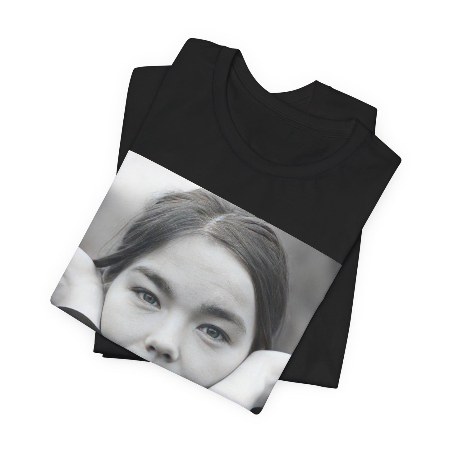 A black graphic t-shirt featuring a black and white portrait photo of Bjork.