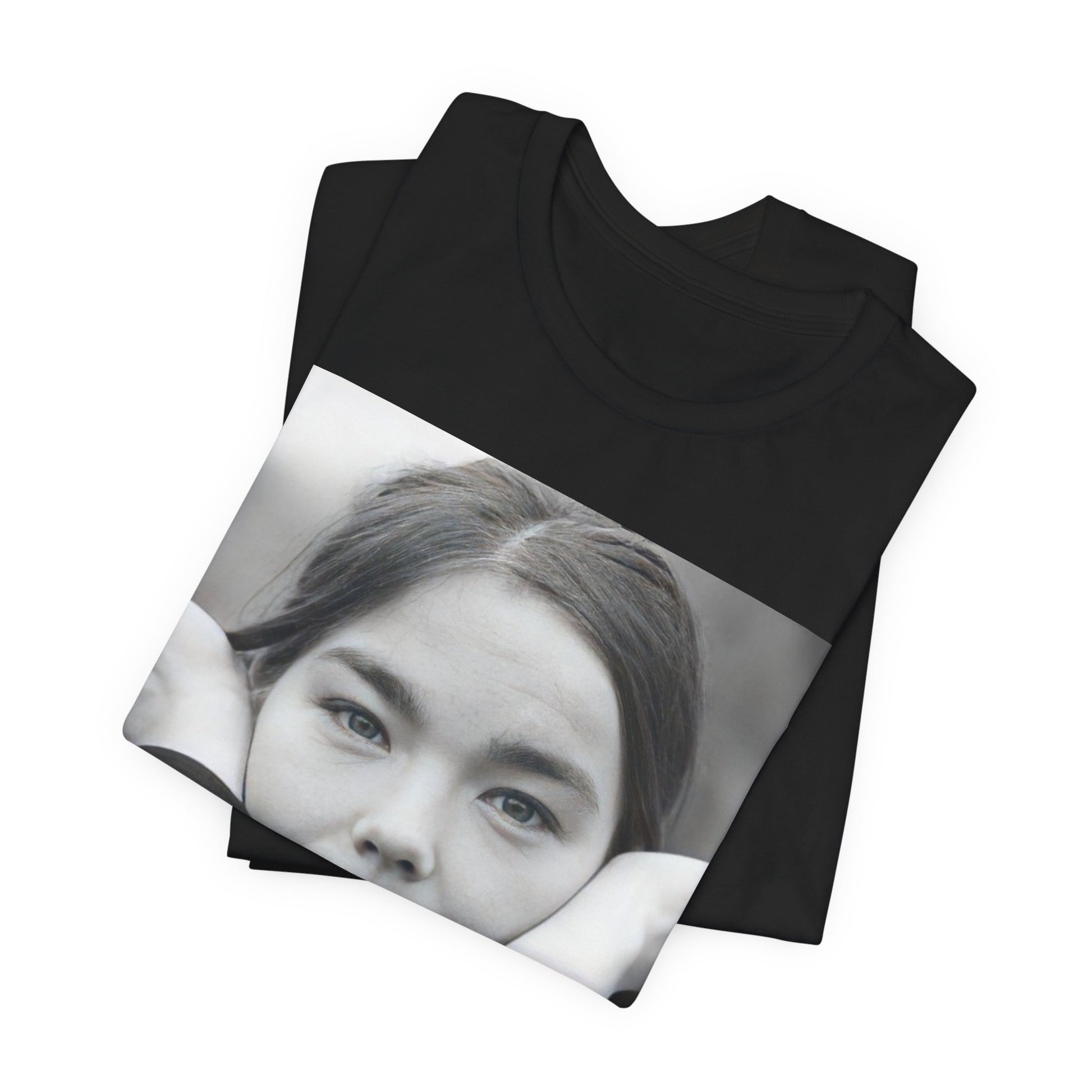 A black graphic t-shirt featuring a black and white portrait photo of Bjork.