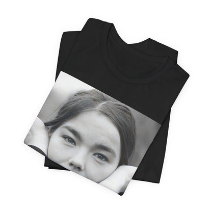 A black graphic t-shirt featuring a black and white portrait photo of Bjork.
