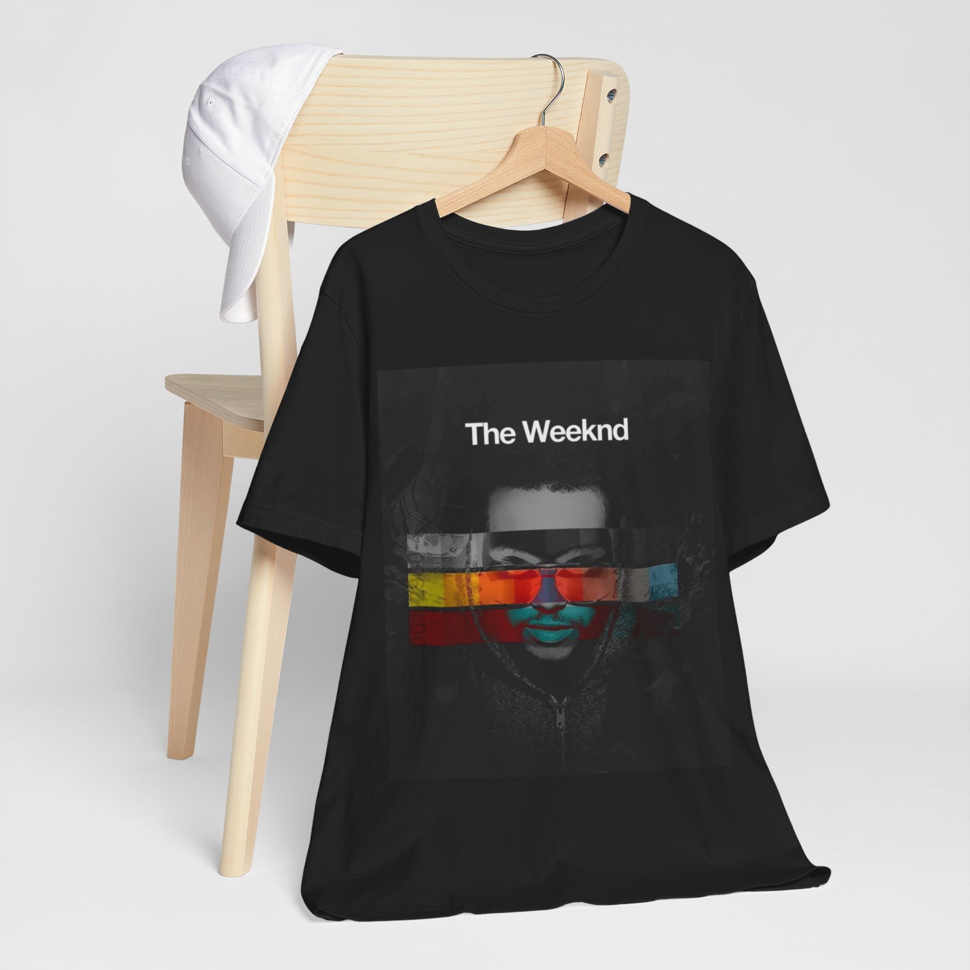 A black graphic t-shirt featuring a retro graphic related to The Weeknd's 'House of Balloons' mixtape.