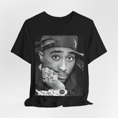 A black graphic t-shirt featuring a bold graphic of Tupac as a rap superstar.