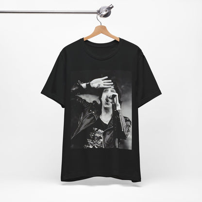 A black graphic t-shirt featuring a black and white portrait photo of The Strokes band.