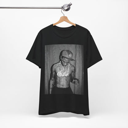 A black graphic t-shirt featuring a graphic of Travis Scott as the Houston rap king.