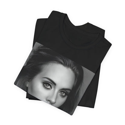A black graphic t-shirt featuring a classic black and white, monochrome portrait of Adele, showing her with a serene or thoughtful expression.