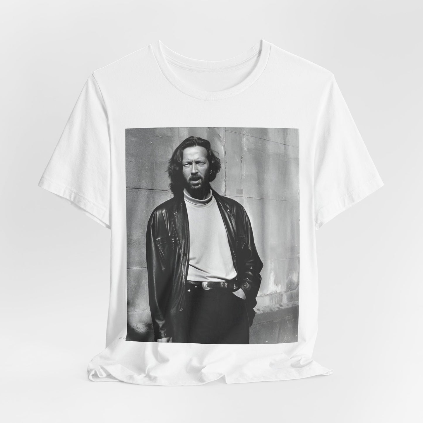 A black graphic t-shirt featuring a retro graphic related to Eric Clapton's 'Cocaine' song or era.