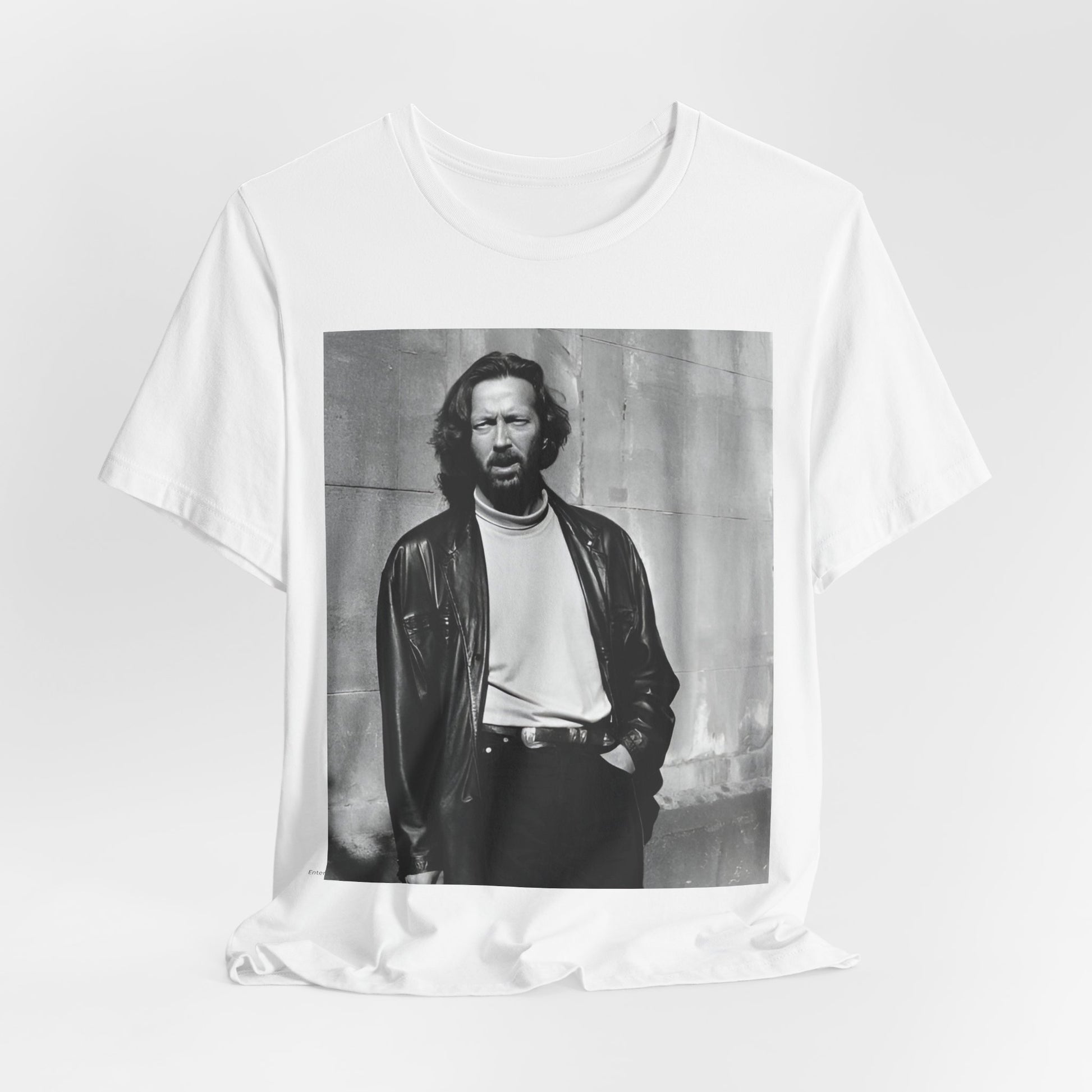 A black graphic t-shirt featuring a retro graphic related to Eric Clapton's 'Cocaine' song or era.