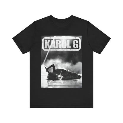 A black graphic t-shirt featuring a black and white graphic or photo of Karol G performing live on stage.