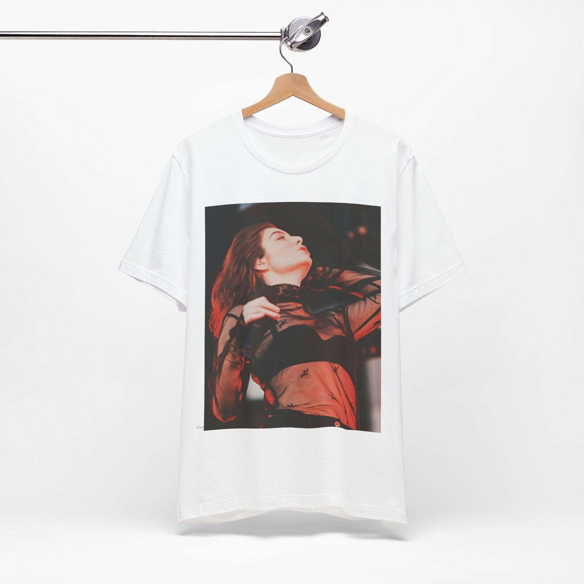 A black graphic t-shirt featuring a graphic of Lorde emphasizing raw emotion.