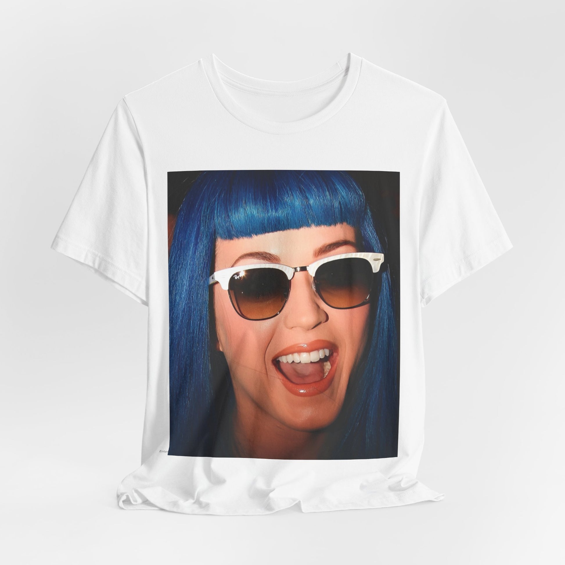 A black graphic t-shirt featuring a retro graphic of Katy Perry with blue hair.