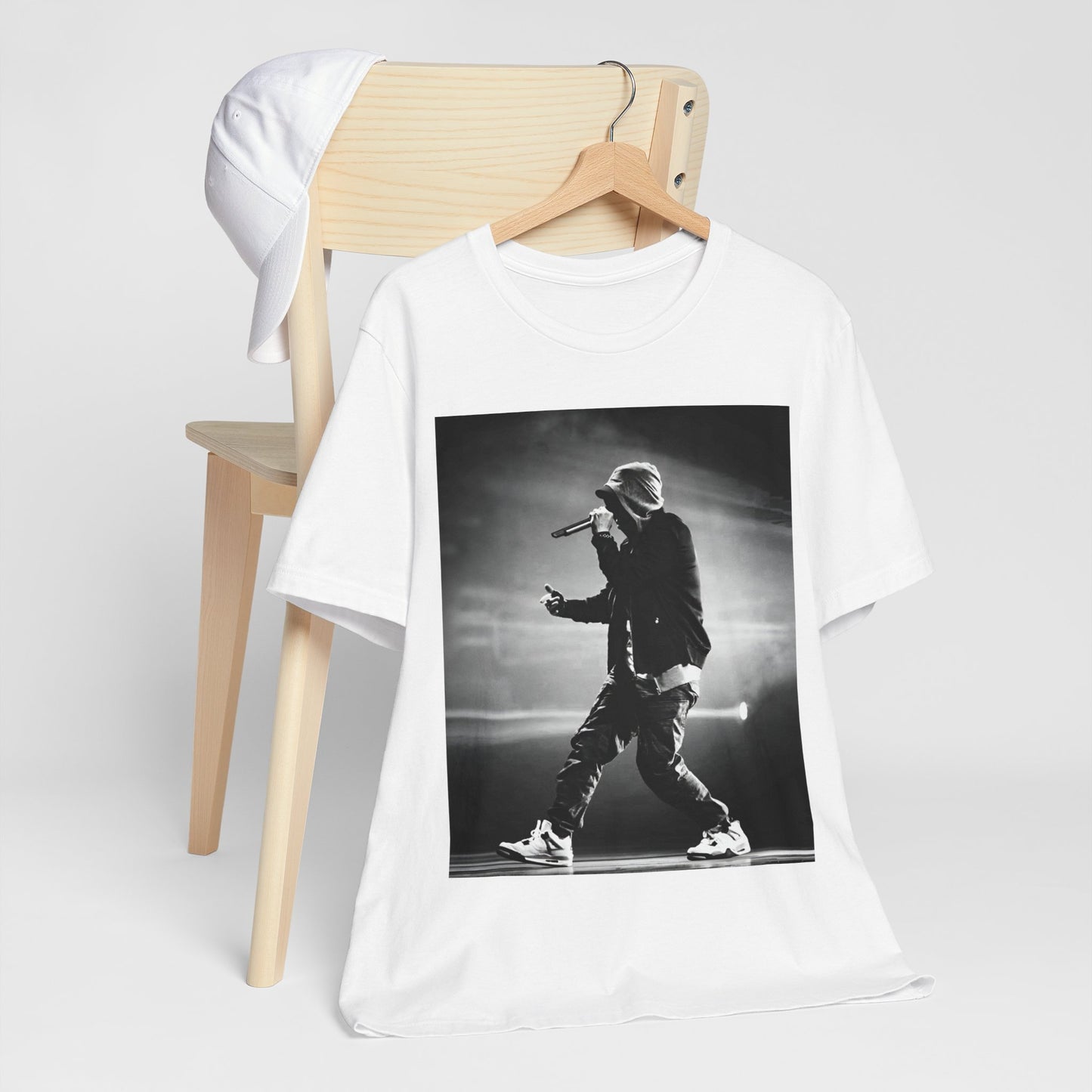 A black graphic t-shirt featuring a boxy hip hop aesthetic graphic of Eminem.