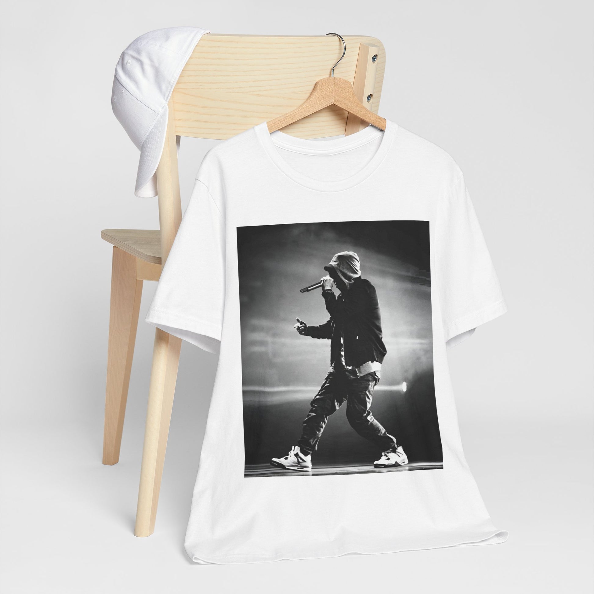 A black graphic t-shirt featuring a boxy hip hop aesthetic graphic of Eminem.