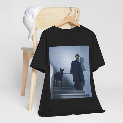 A black graphic t-shirt featuring a photo of The Weeknd with a doberman.