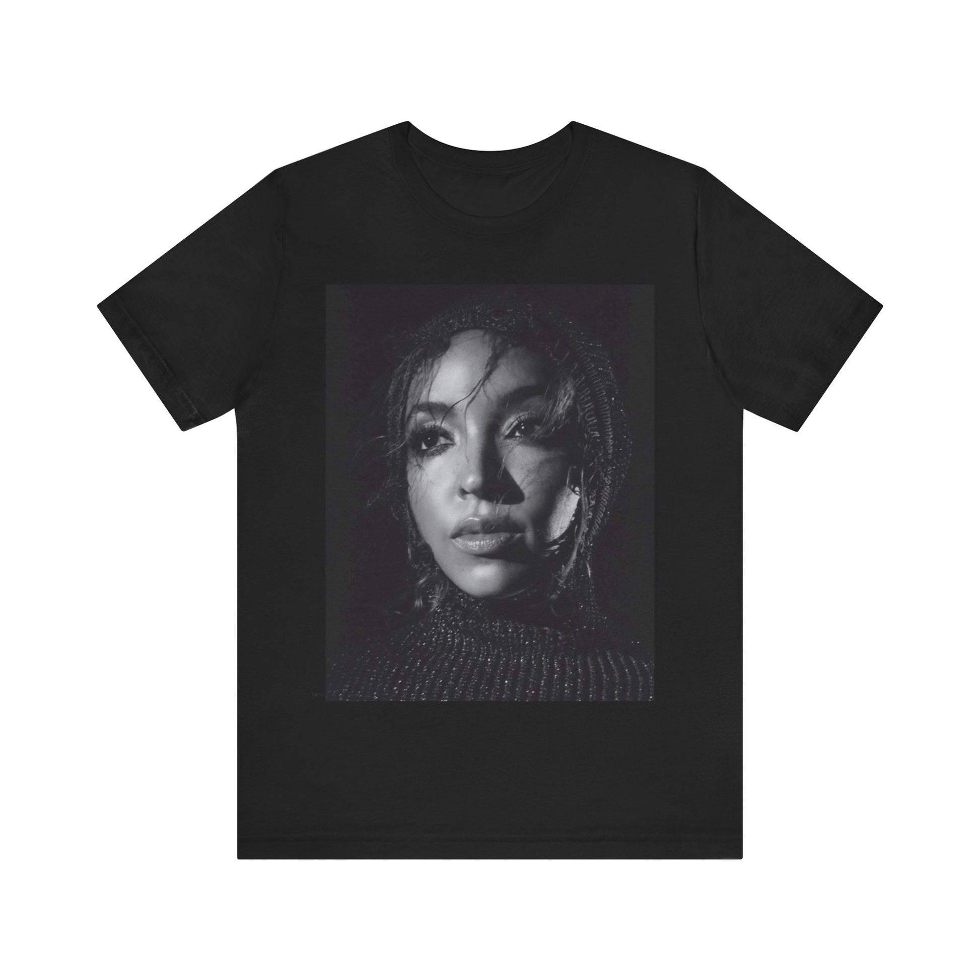 A black graphic t-shirt featuring a black and white portrait photo of Tinashe.