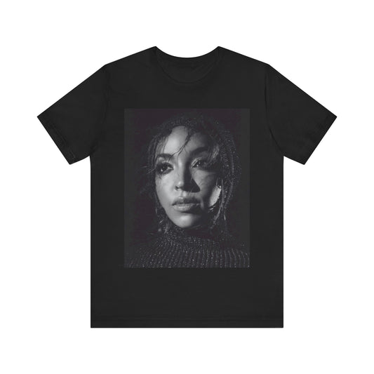 A black graphic t-shirt featuring a black and white portrait photo of Tinashe.