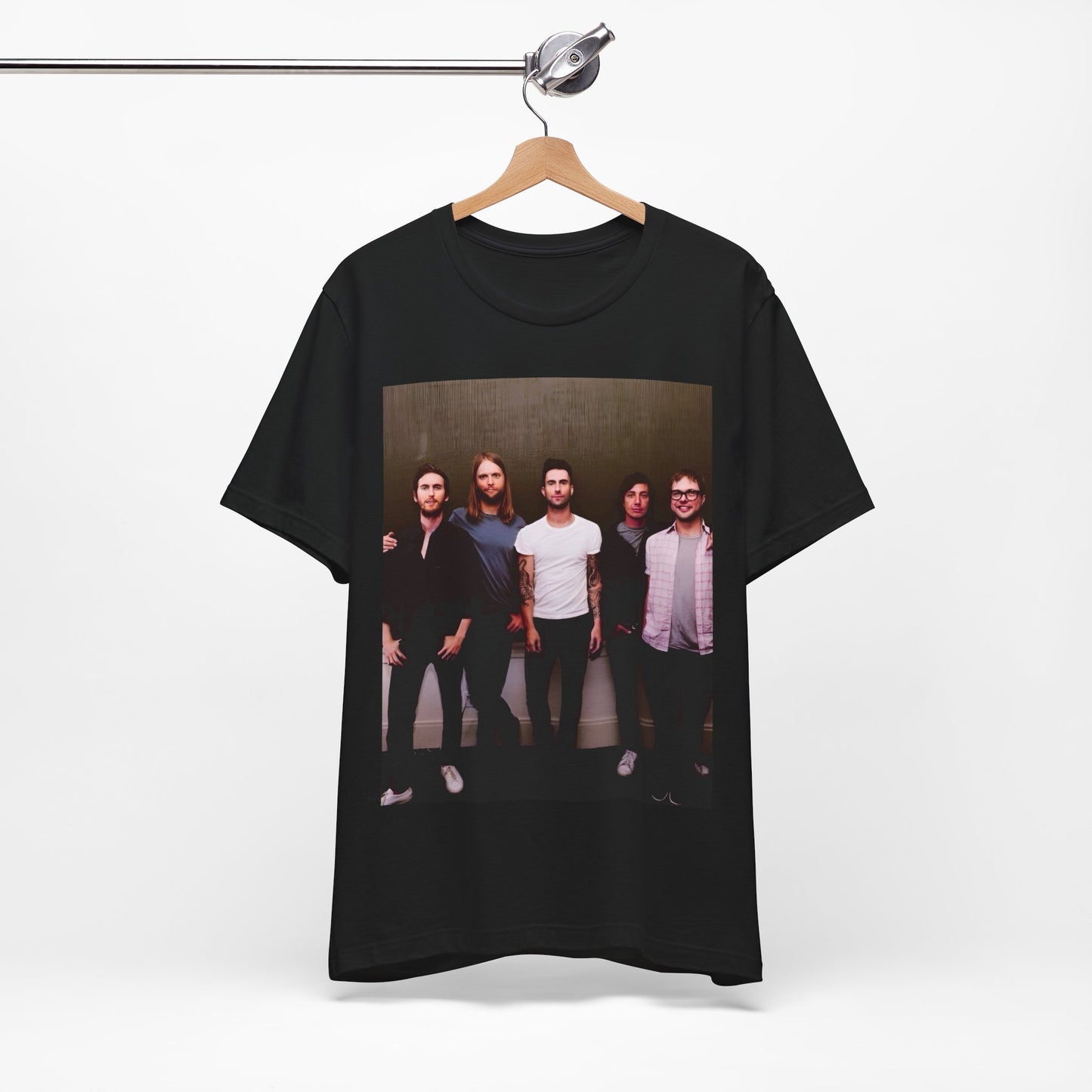 A black cotton Maroon 5 t-shirt featuring a graphic of an artistic, emotional heart design.
