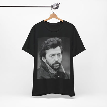 A black graphic t-shirt featuring a 70s rock aesthetic graphic of Eric Clapton.