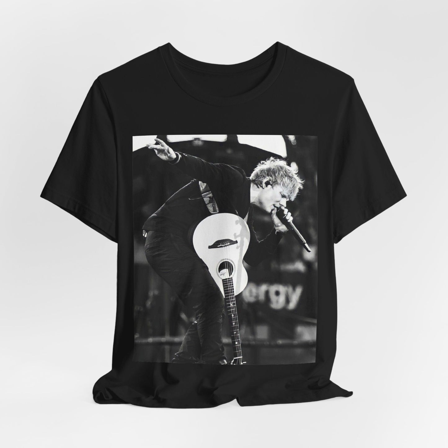A black graphic t-shirt featuring a vintage graphic of Ed Sheeran performing live.