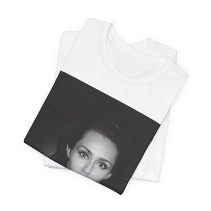 A black graphic t-shirt featuring a graphic related to Miley Cyrus' 'Flowers' song or era.
