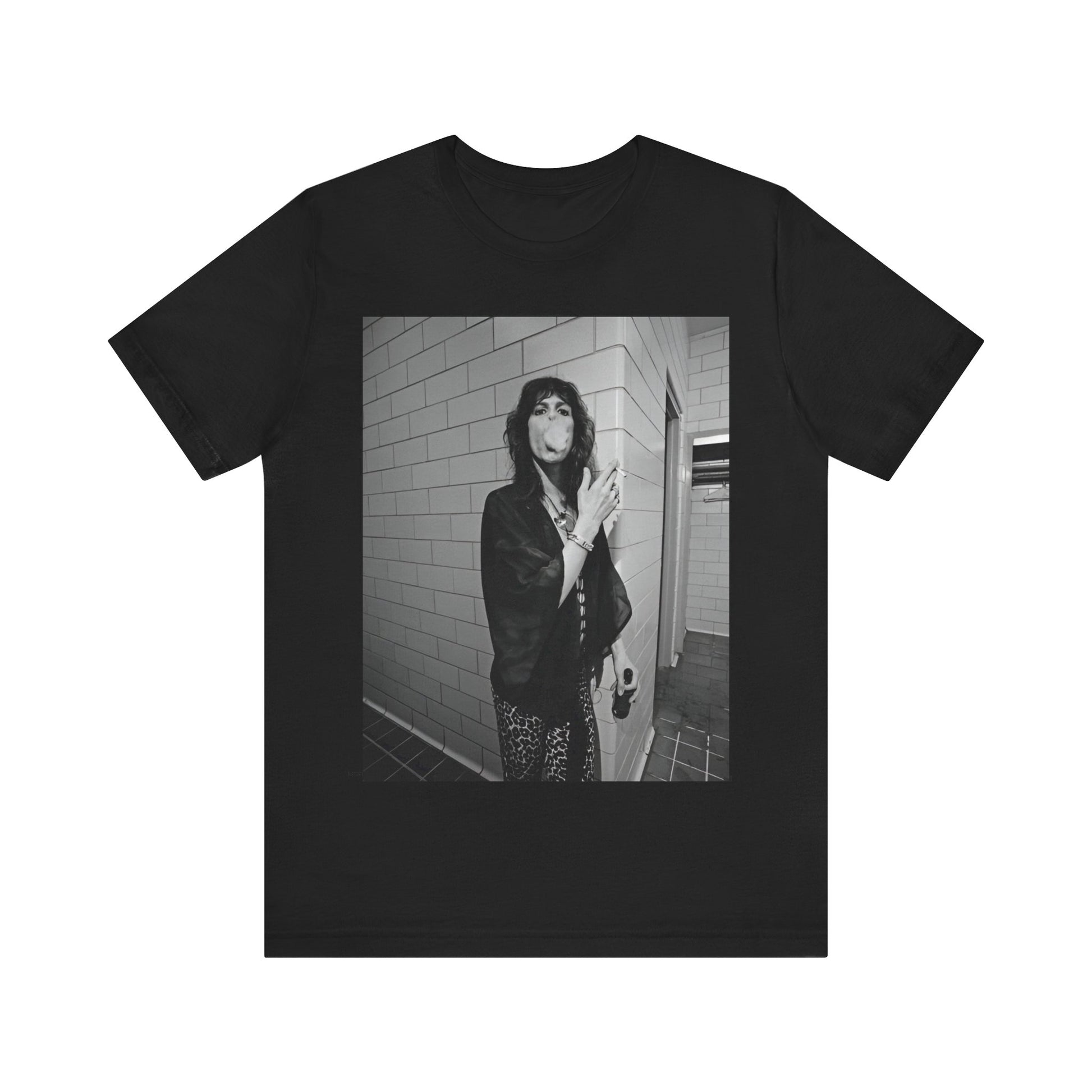 A black graphic t-shirt featuring a retro 70s photo of Aerosmith band members in a backstage setting, showing a candid moment.