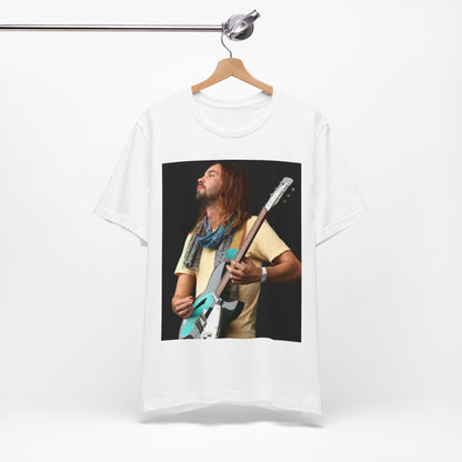 A black graphic t-shirt featuring a vintage indie rock graphic of Tame Impala.