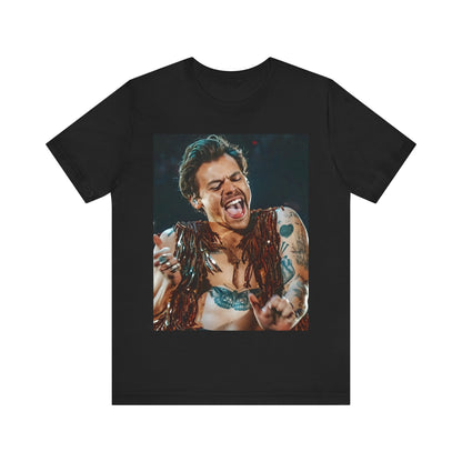A black graphic t-shirt featuring a graphic or photo of Harry Styles performing live on stage.