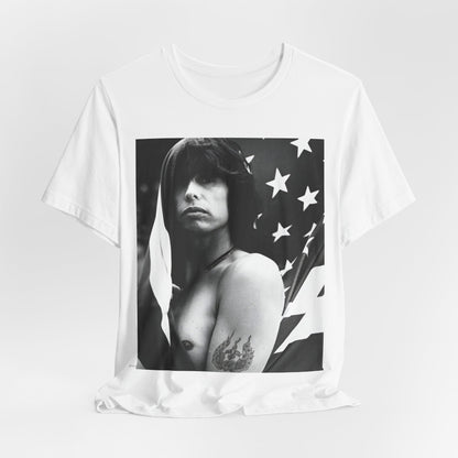 A black graphic t-shirt featuring a retro 70s-style illustration or photo of Aerosmith, integrated with elements of the American flag.