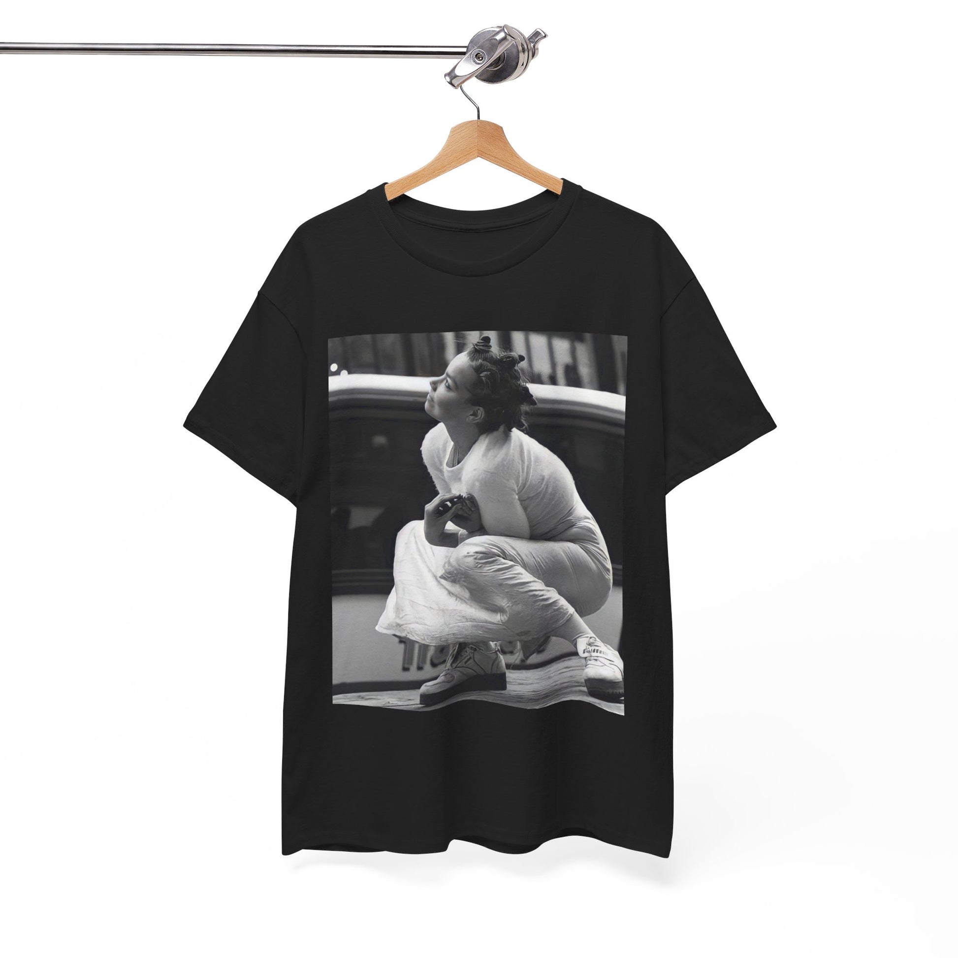 A black graphic t-shirt featuring a graphic of Bjork as an experimental pop icon.
