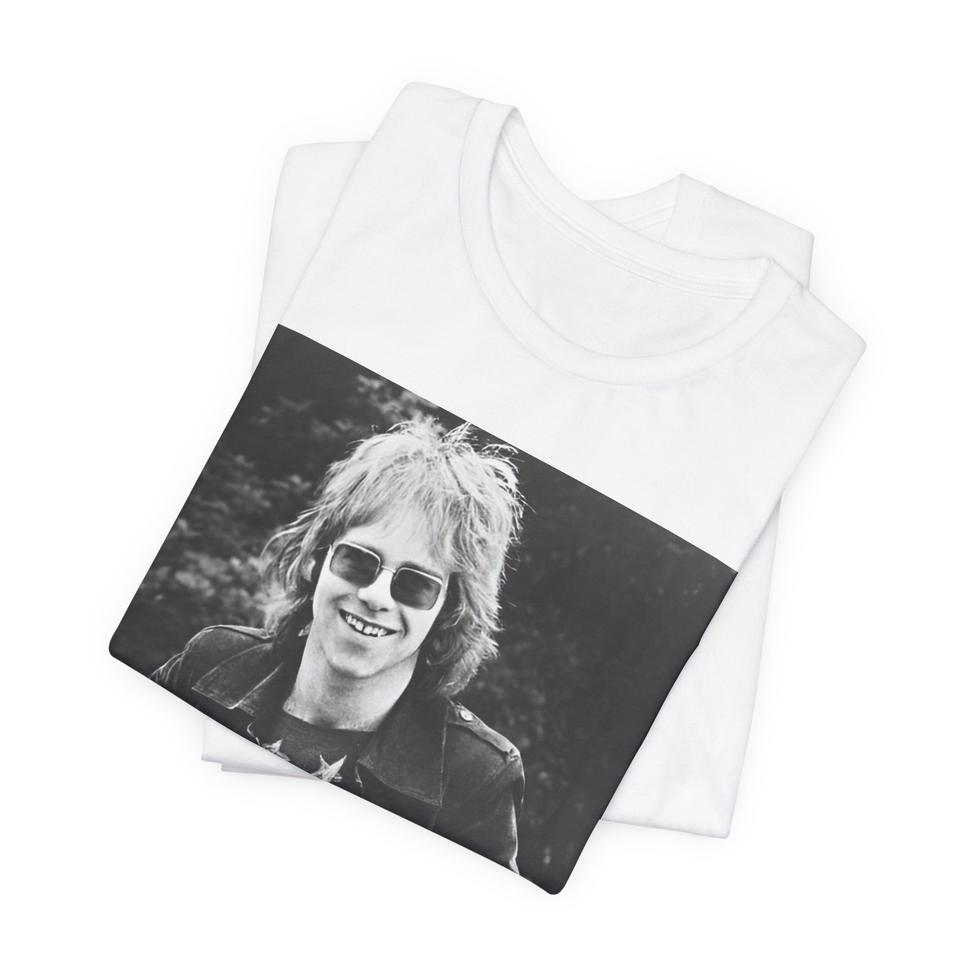 A black graphic t-shirt featuring a 70s black and white monochrome graphic or photo of Elton John.