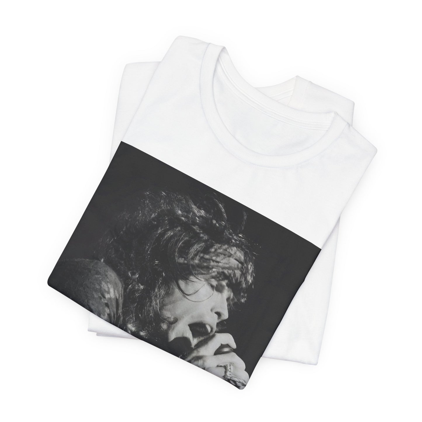 A black graphic t-shirt featuring a retro 70s-style illustration or photo of Aerosmith, designed to evoke their 'On Tour' presence, possibly with band members on stage or tour bus imagery.