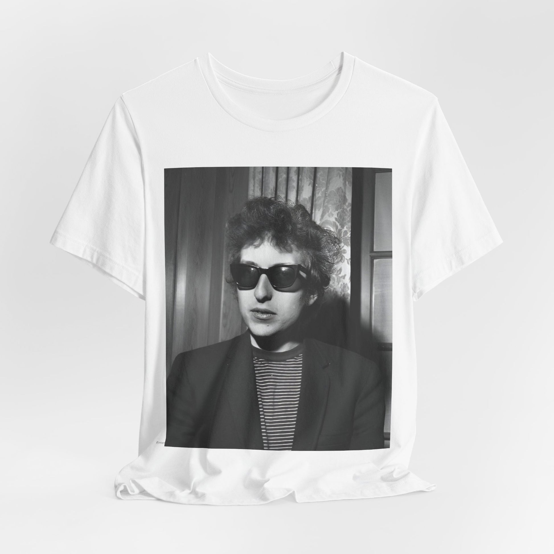 A black graphic t-shirt featuring a graphic related to Bob Dylan's 'The Freewheelin' album era.