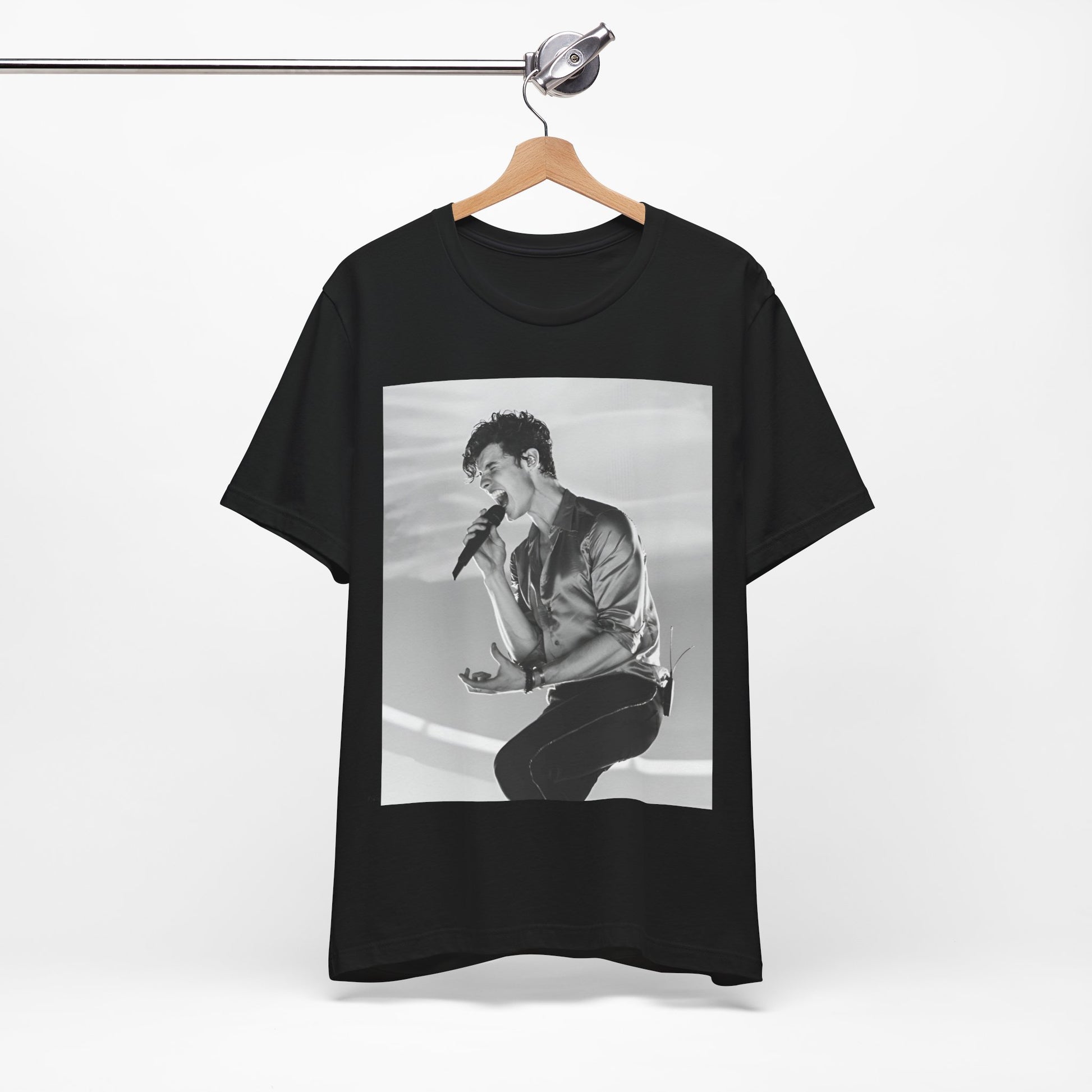 A black graphic t-shirt featuring a black and white graphic or photo of Shawn Mendes as a dreamy pop star.
