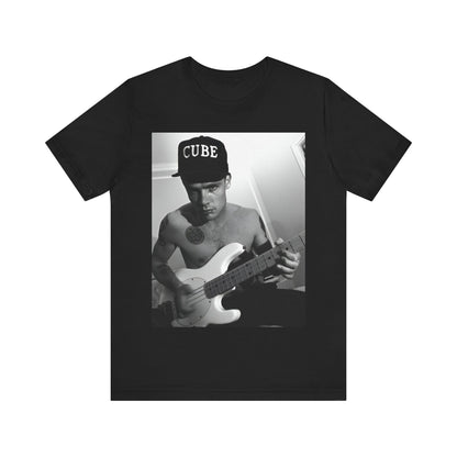 A black graphic t-shirt featuring a black and white graphic or photo of Flea from Red Hot Chili Peppers performing live on stage.