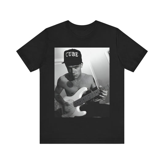 A black graphic t-shirt featuring a black and white graphic or photo of Flea from Red Hot Chili Peppers performing live on stage.