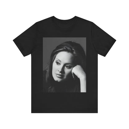 A black graphic t-shirt featuring a vintage-style black and white studio portrait of Adele, showing her with a poised and elegant expression.