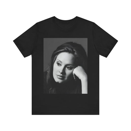 A black graphic t-shirt featuring a vintage-style black and white studio portrait of Adele, showing her with a poised and elegant expression.