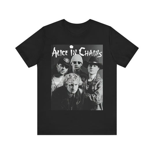 A black graphic t-shirt featuring a black and white photographic portrait of the band Alice In Chains, capturing their iconic grunge look.