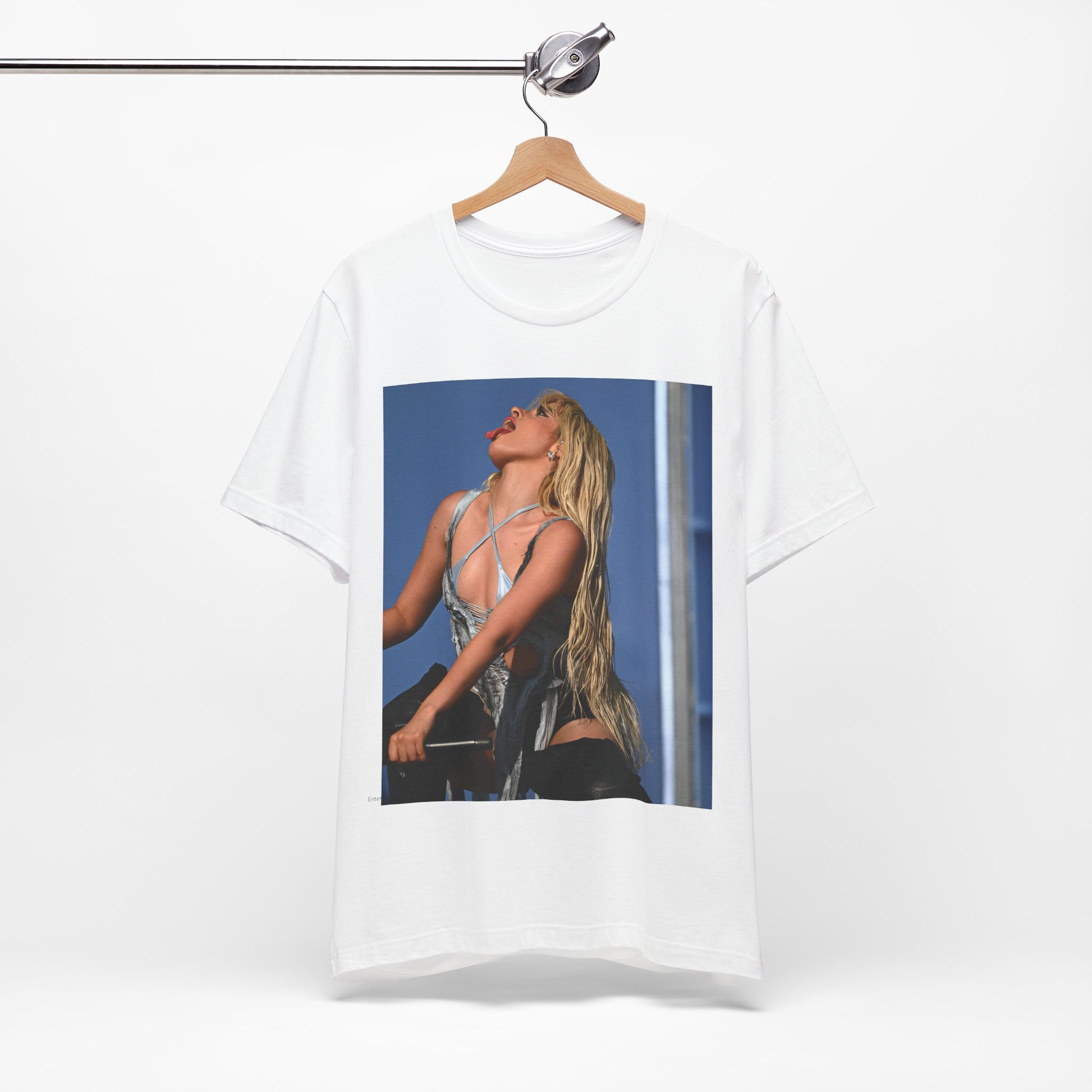 A black graphic t-shirt featuring a dynamic graphic or photo of Camila Cabello performing live on stage.