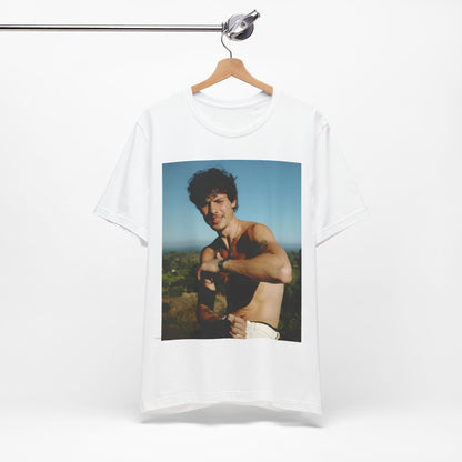 A black graphic t-shirt featuring a graphic of Shawn Mendes with a chill pop star look.