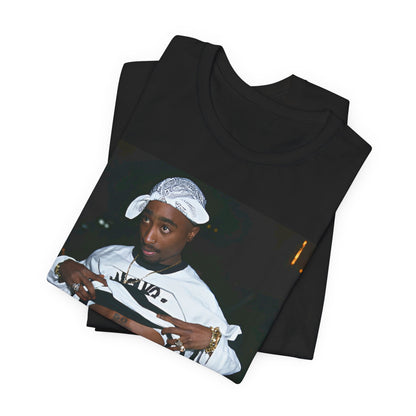 A black graphic t-shirt featuring a graphic of Tupac Shakur (2Pac).