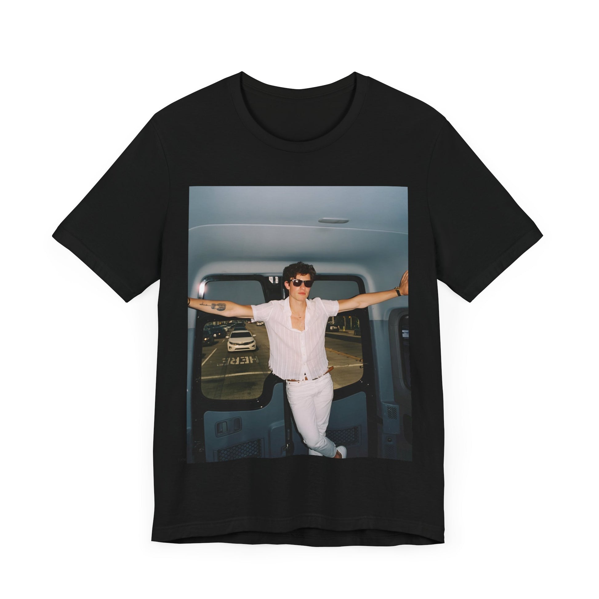 A black graphic t-shirt featuring a graphic of Shawn Mendes with a classic confident look.