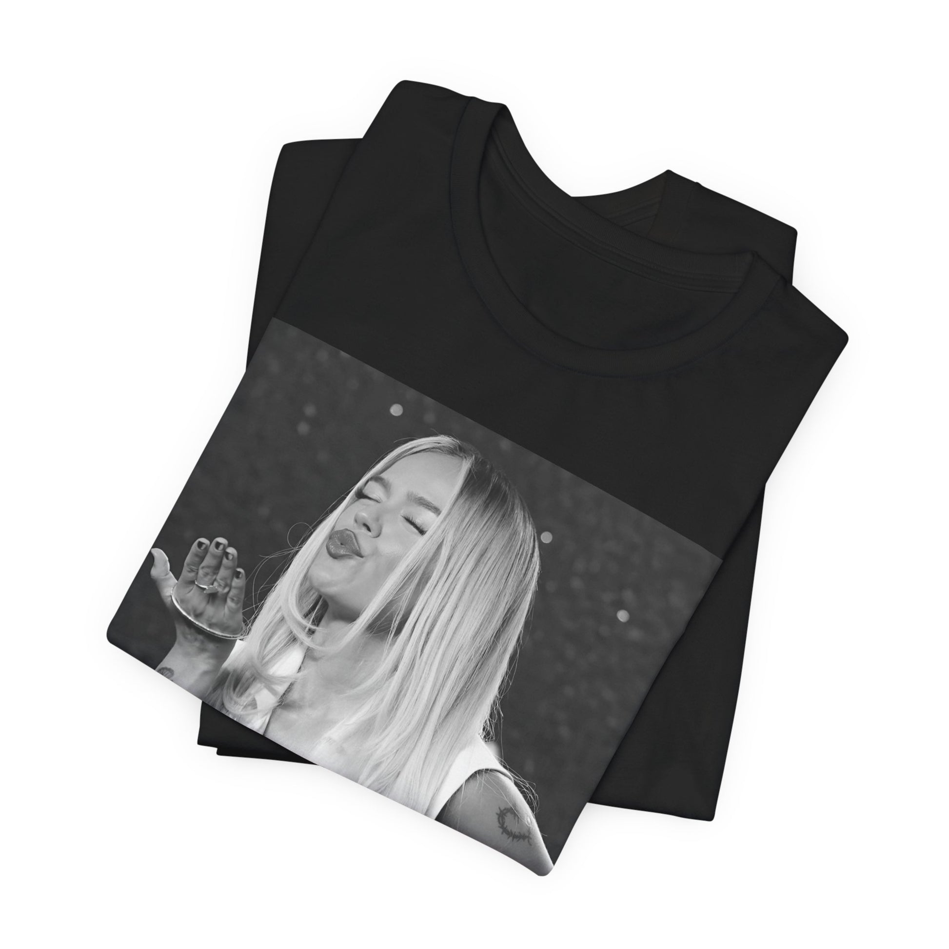 A black graphic t-shirt featuring a graphic of Karol G with a 'La Bichota Kiss' theme.