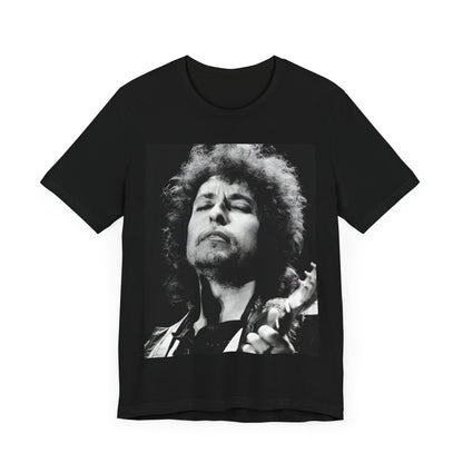 A black graphic t-shirt featuring a retro black and white graphic or photo of Bob Dylan performing live.