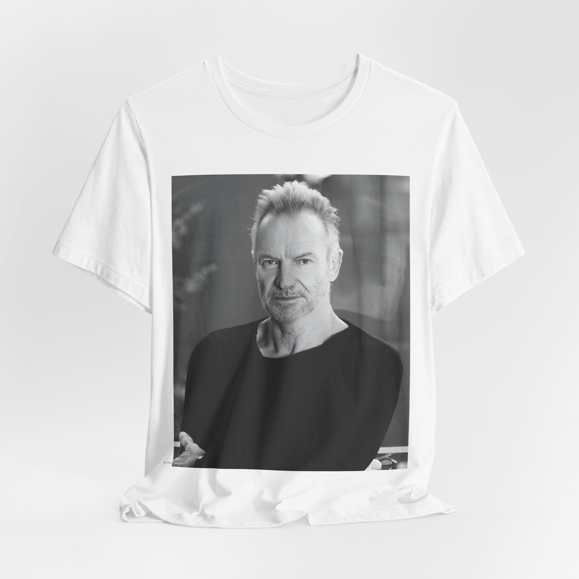 A black graphic t-shirt featuring a vintage graphic related to Sting's 'Desert Rose' song or era.