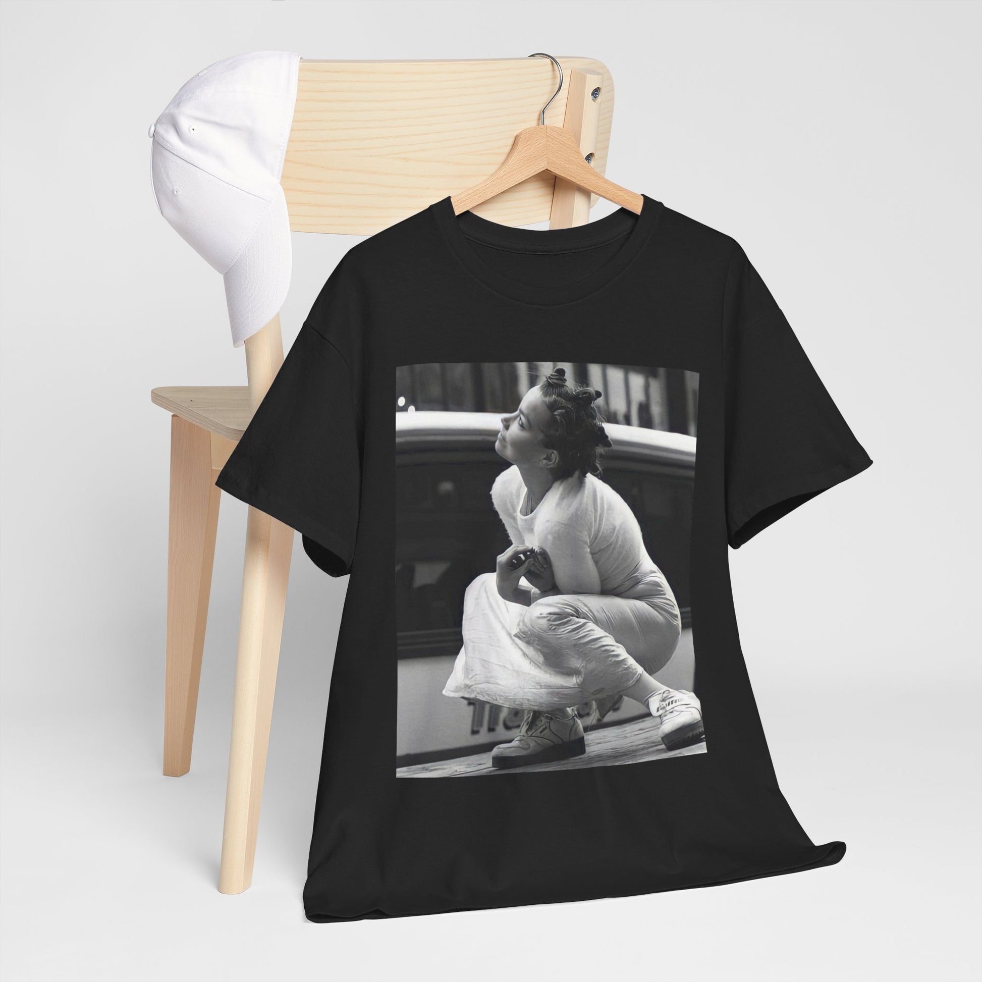 A black graphic t-shirt featuring a graphic of Bjork as an experimental pop icon.
