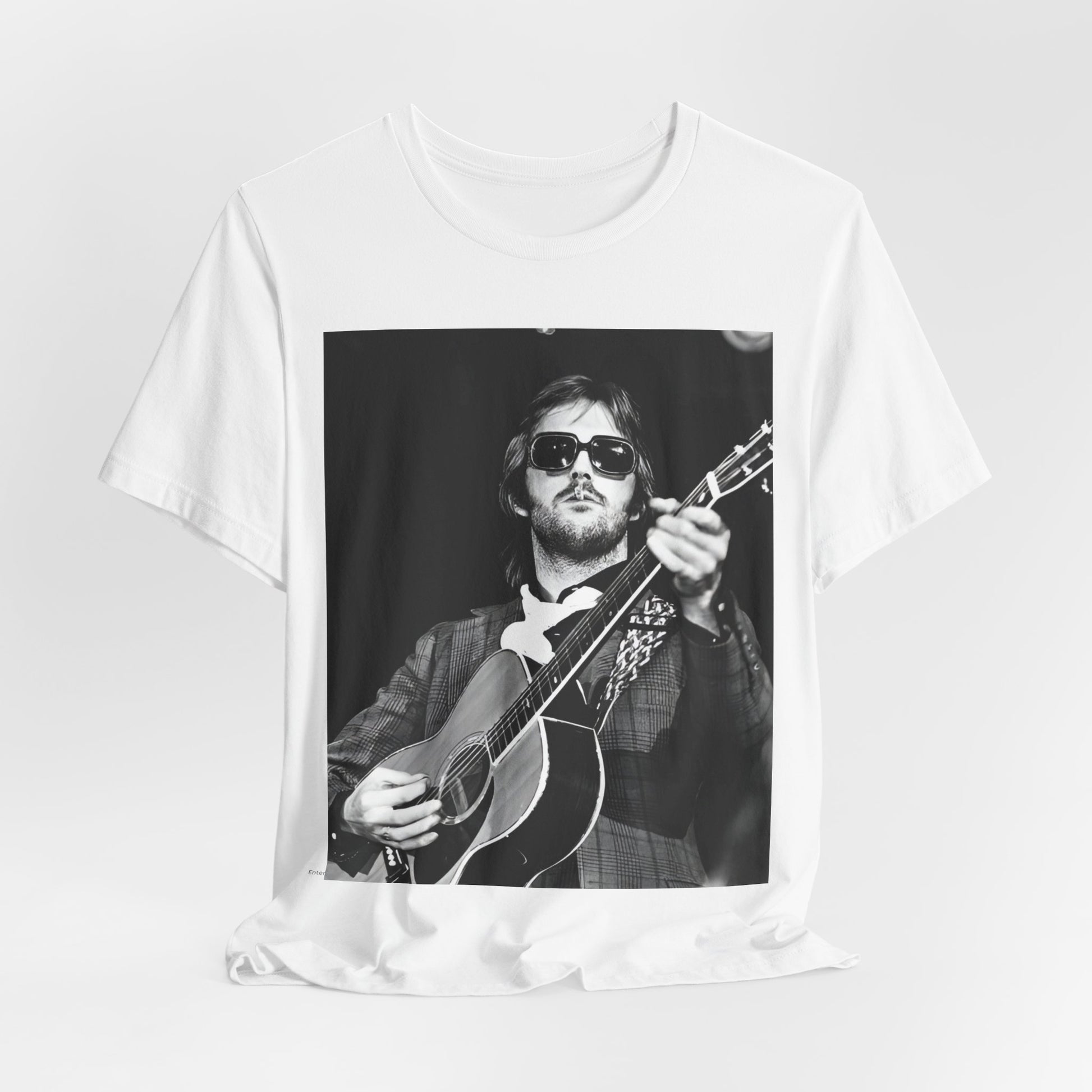 A black graphic t-shirt featuring a graphic of Eric Clapton with a chill blues rock vibe.